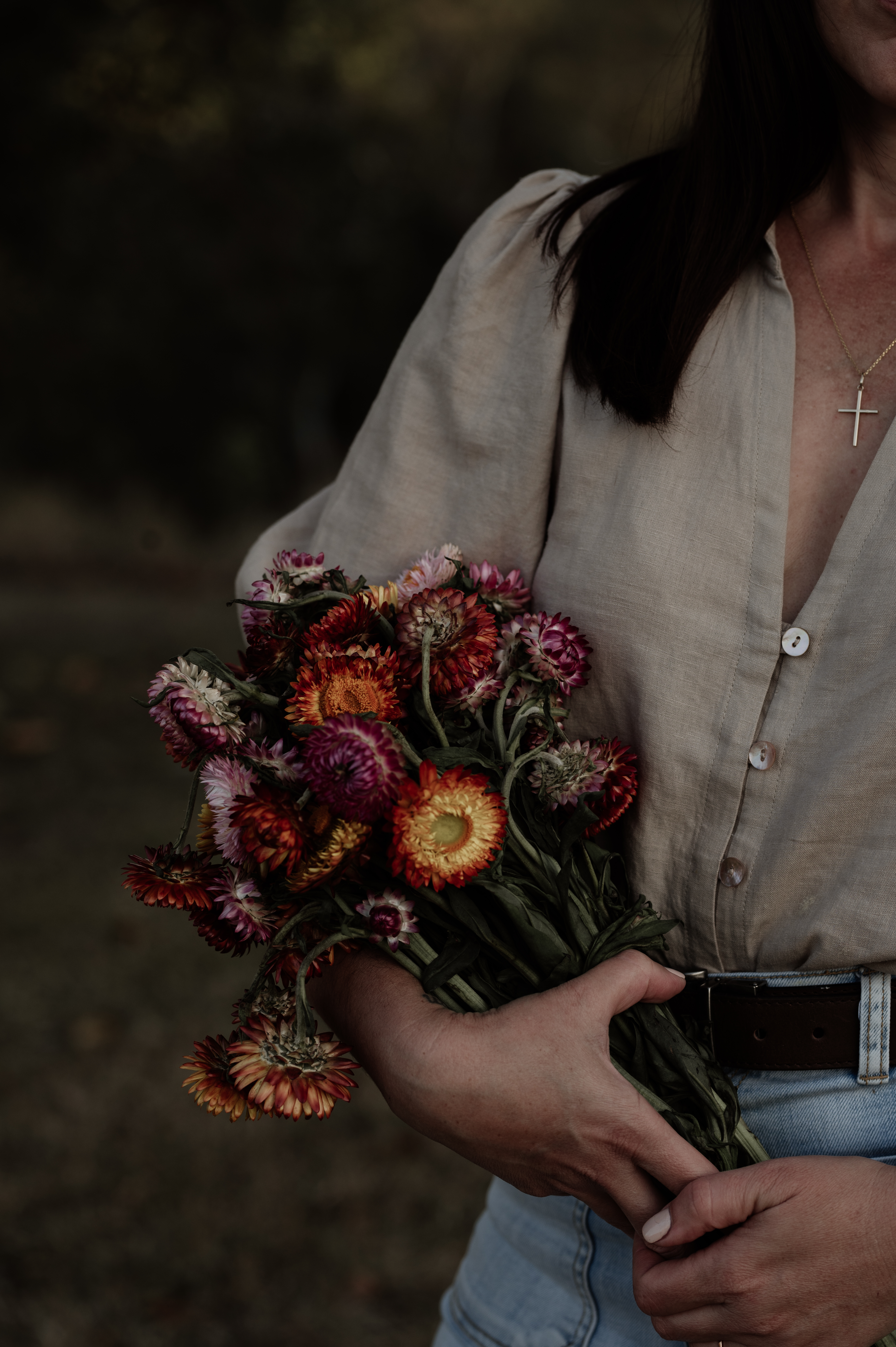 hands holding a bunch of flowers